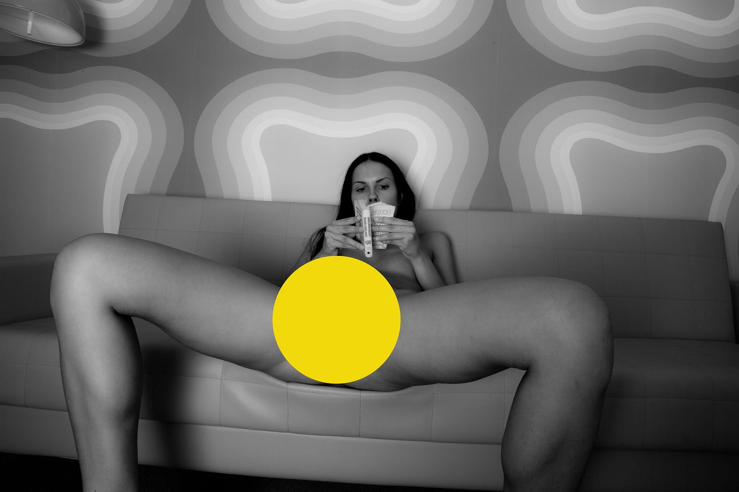 Artistic circle in black and white photograph with yellow accent for Yoni Trataka meditation