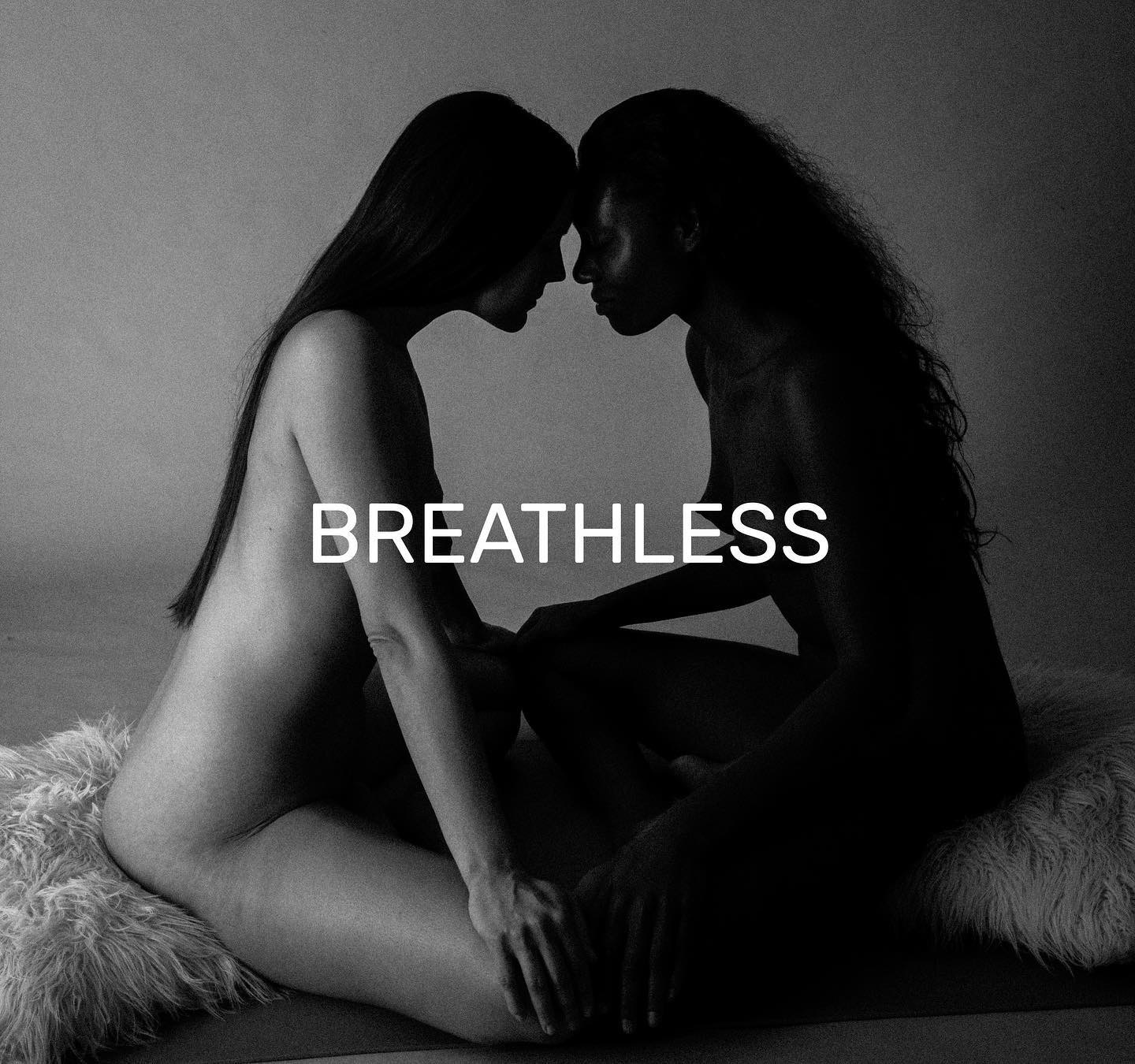 Two women in intimate artistic black and white pose with BREATHLESS text overlay - tantric connection and sacred feminine energy at Forbidden Yoga