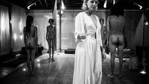 Woman in group ceremony captured in black and white photograph during de-coupling ritual