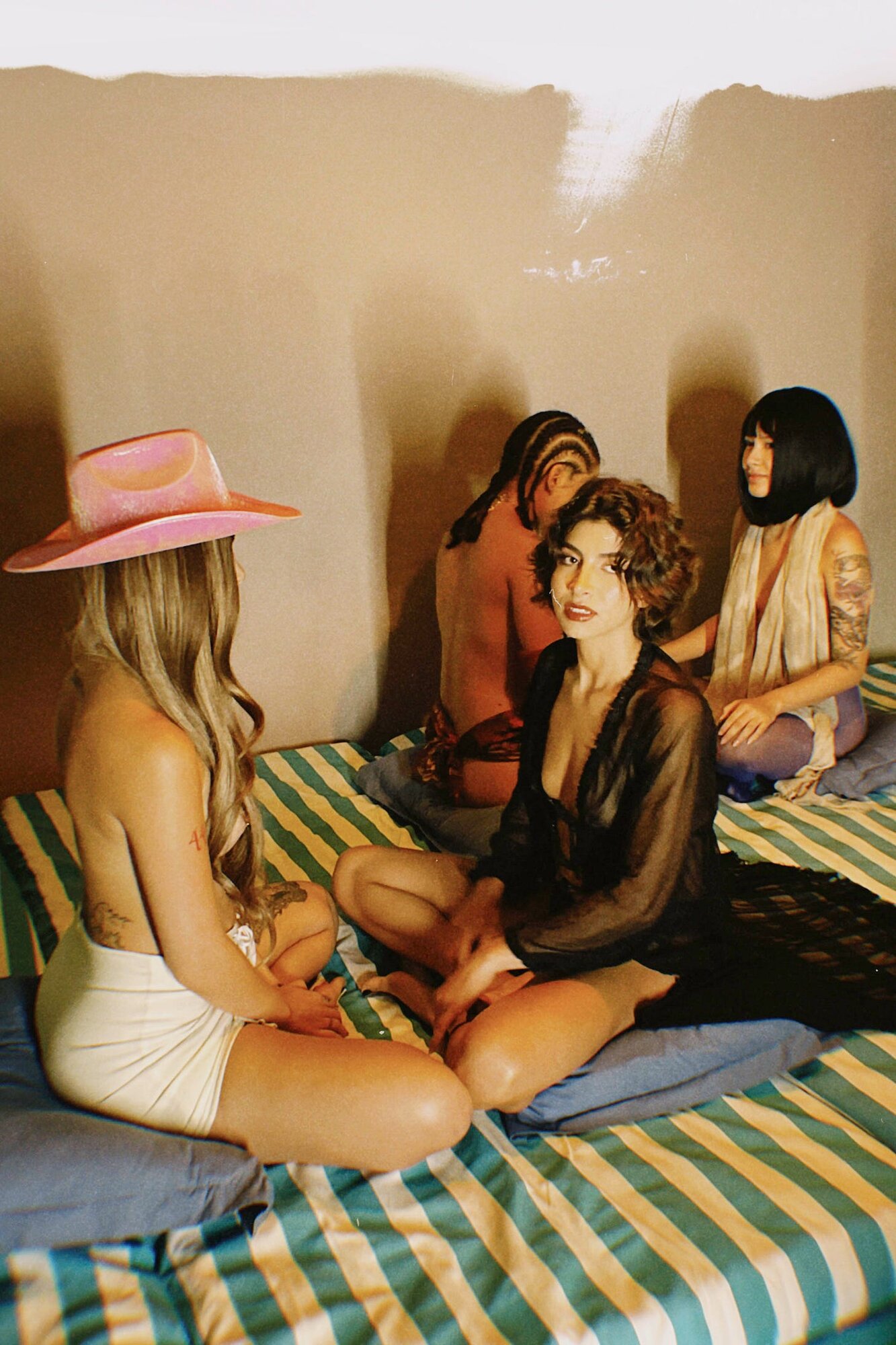 Women at intimate tantric retreat gathering exploring relationship dynamics and energetic debt