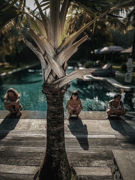 Women meditating in three sitting poses at tropical retreat